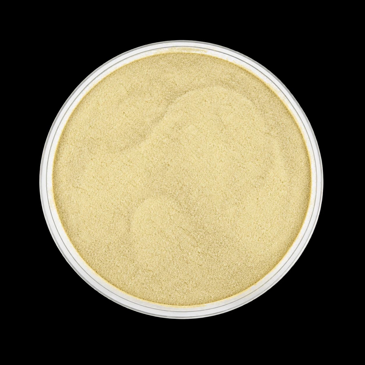 Illustrative white tomato starch microencapsulated powder in a glass sample dish